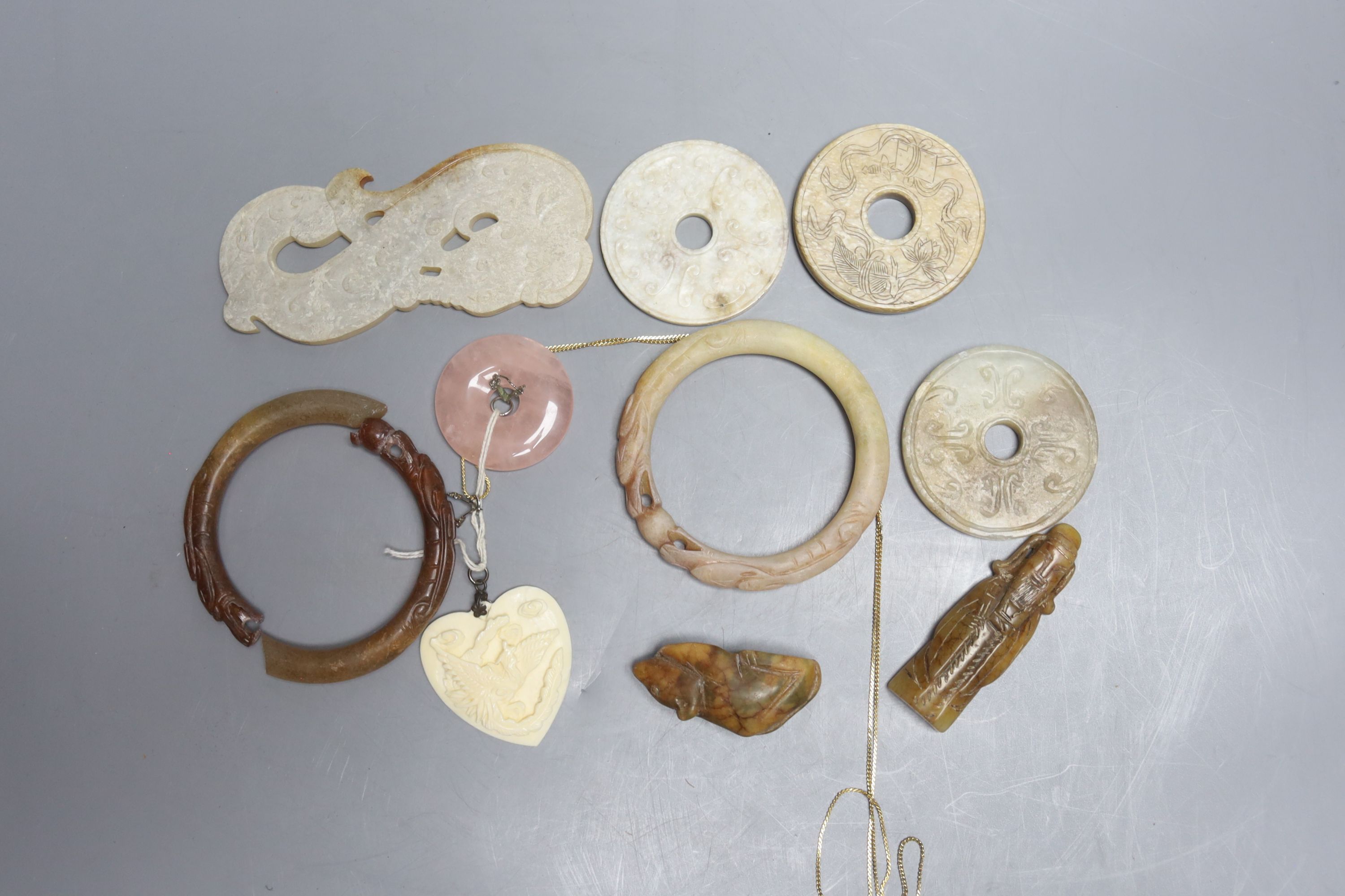 A quantity of assorted jade bi discs and other hardstones